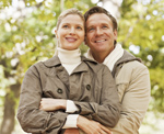 Photo of a man and woman smiling for a picture. Link to Life Stage Gift Planner Under Age 45 Gifts.