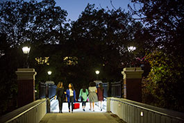 Students walking on campus at night. Link to Gifts of Appreciated Securities